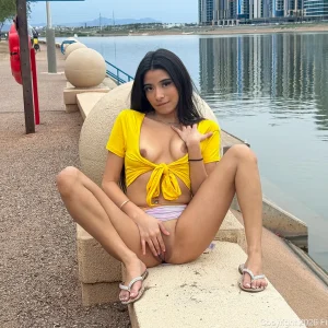Petite FTVGirls model Monica posing naturally outdoors near a river