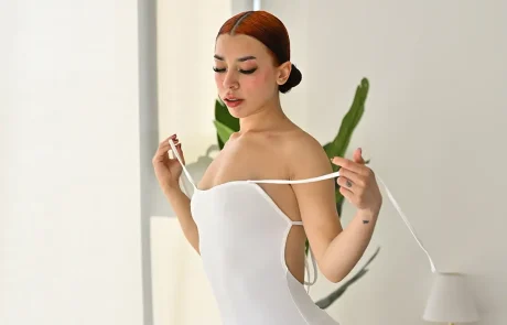 Geni FTVGirls redhead showing her curves in a fitted white dress
